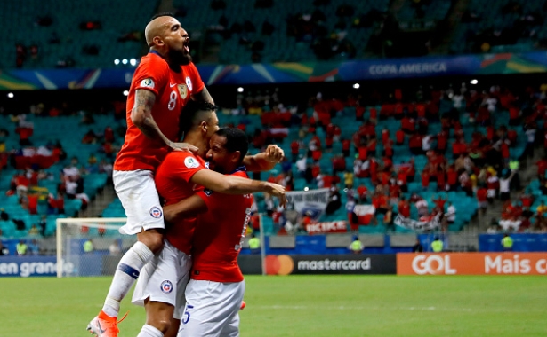 Chile make the last eight, as Japan hold Uruguay